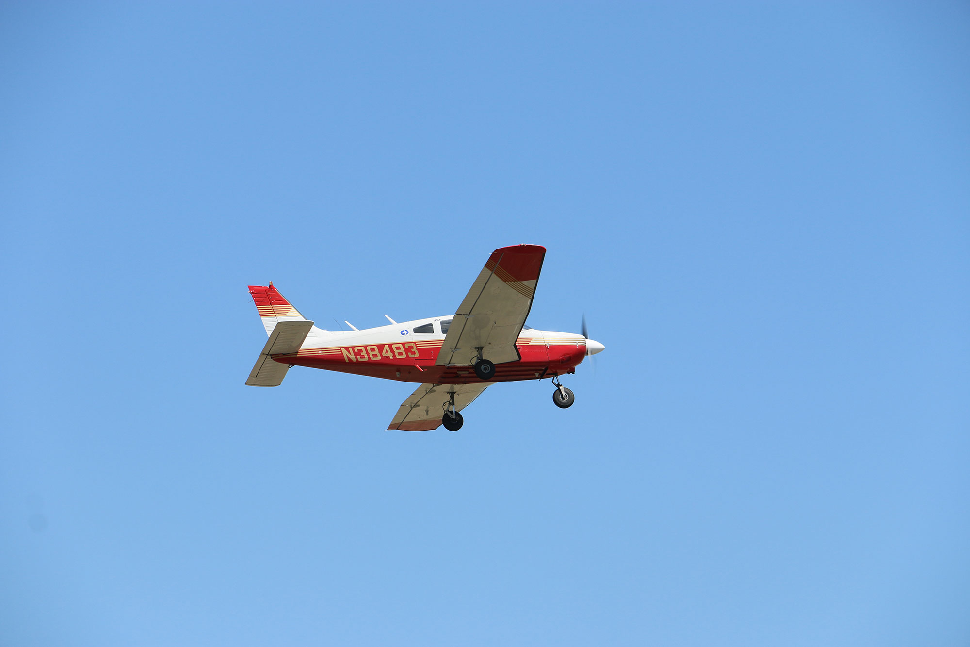 plane coming in for a landing with gears down
